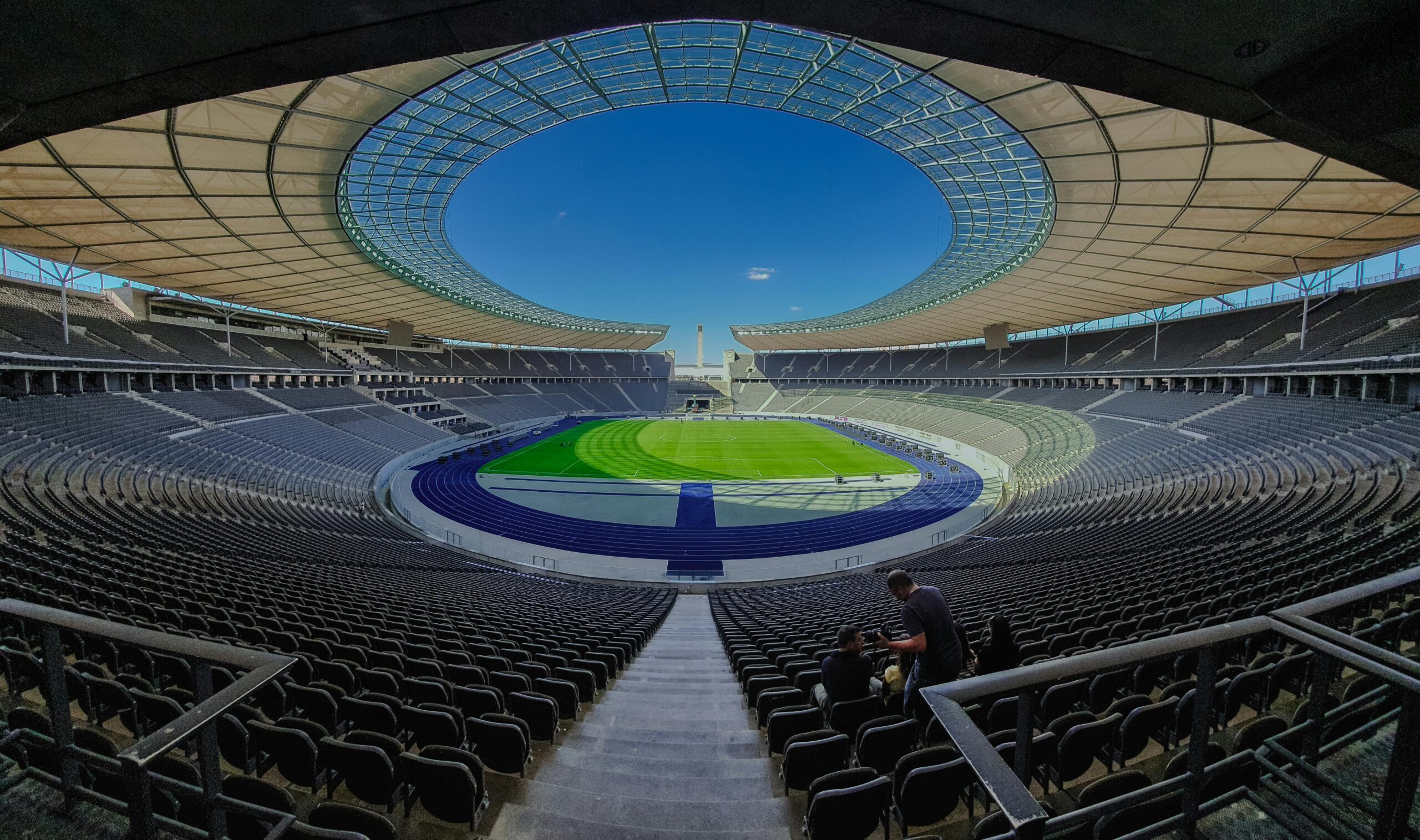 A wide-angle shot of the iconic Berlin Olympic Stadium showcasing its grandeur and modern architecture.